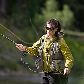 Woman fly fishing