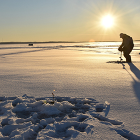 Man ice fishing 