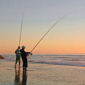 People fishing at the beach