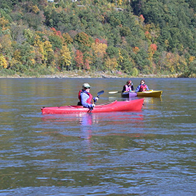 People in kayaks during fall