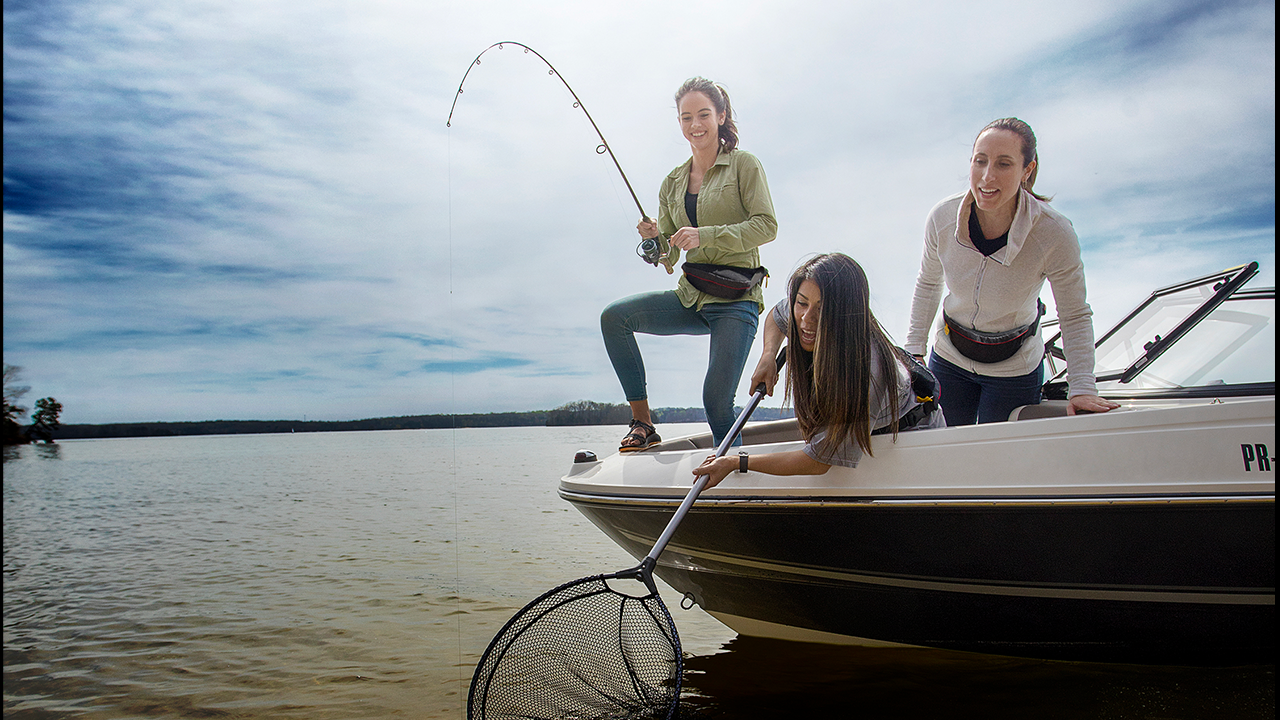 Two women are fishing on