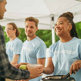 People volunteering at soup kitchen