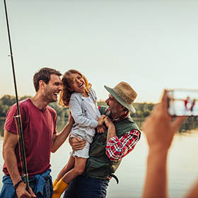 family fishing on a lake 