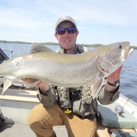 angler lake fishing for trout in minnesota