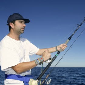 angler fishing with his current sport fishing license