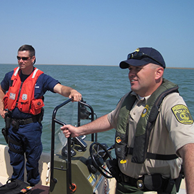 Officers inspecting a boat
