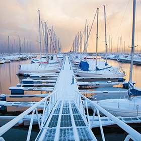 Boats at a dock in winter