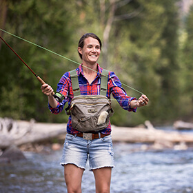 Woman fly fishing