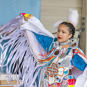 Native American young woman dancing