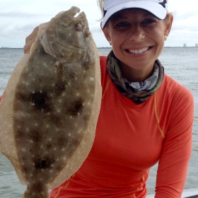 women angler learning how to fish for flounder