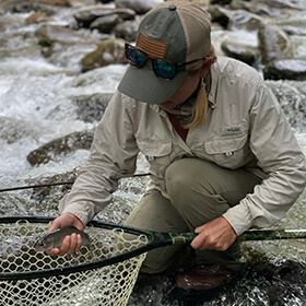 Woman fly fishing