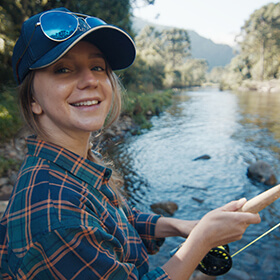 Woman fly fishing