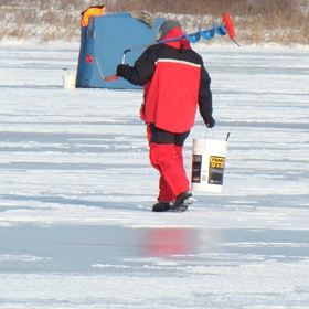 angler enjoying his ice fishing vacations