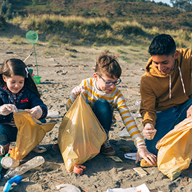 Kids cleaning up at the shore