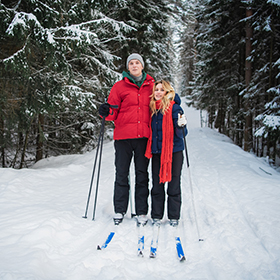 Two people cross country skiing